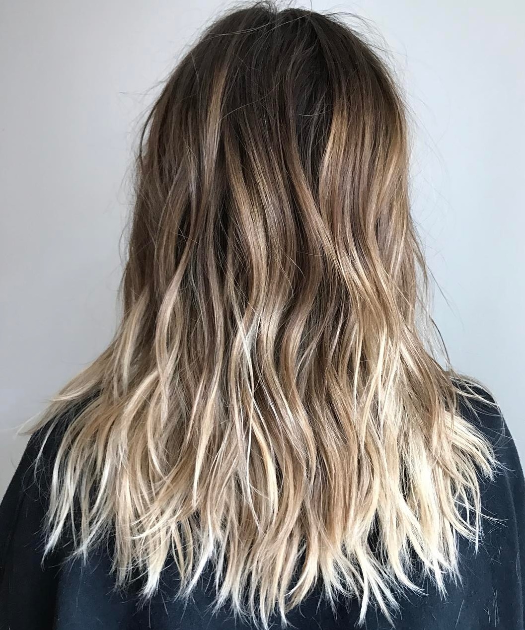 Lange gesneden snit met blonde ombre